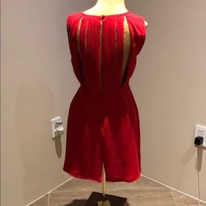 Red cocktail dress w back detail.